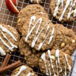 Apple Pie Cookies with white chocolate drizzle on a cookie rack.