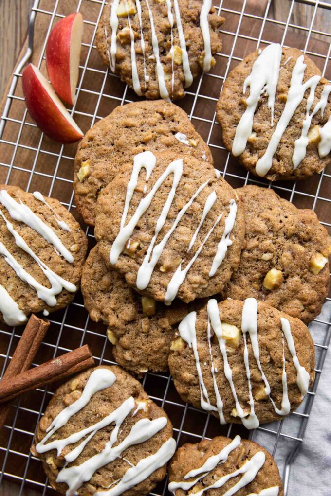 Apple Pie Cookies with white chocolate drizzle on a cookie rack.