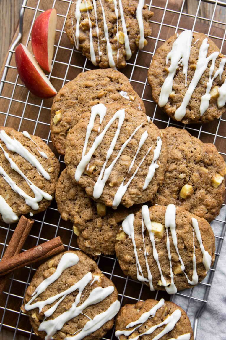 Apple Pie Cookies with white chocolate drizzle on a cookie rack.