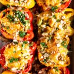 Top shot photo of Chicken & Rice Stuffed Peppers in a baking dish.
