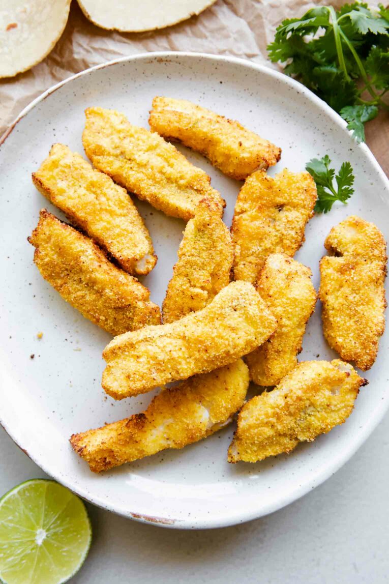 Crispy air fryer breaded cod on a plate.