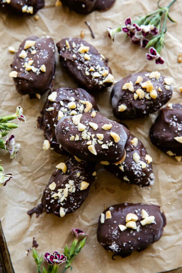 Date Snickers (Peanut Butter Yogurt Dates) on parchment paper.