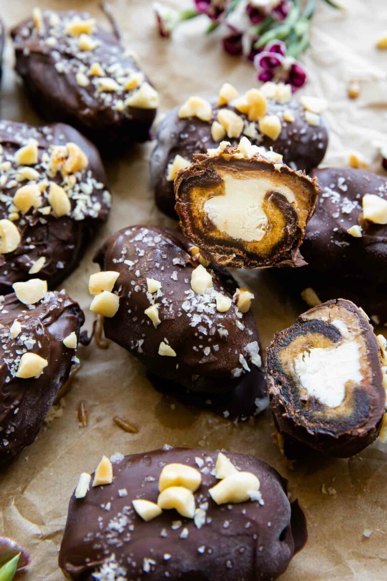 Angled photo of date snickers with yogurt and peanut butter.