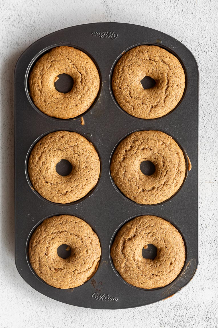 Baked maple donuts in a pan.