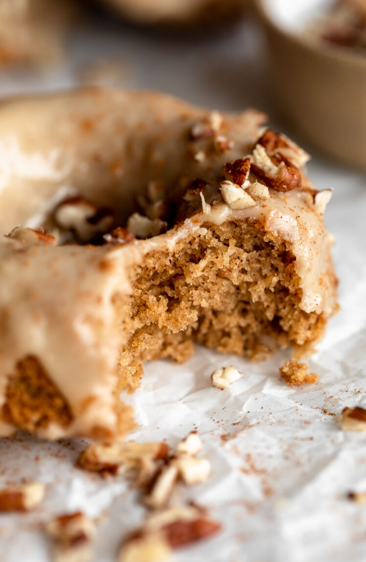Close up of Maple Gluten-Free Donut with pecans.