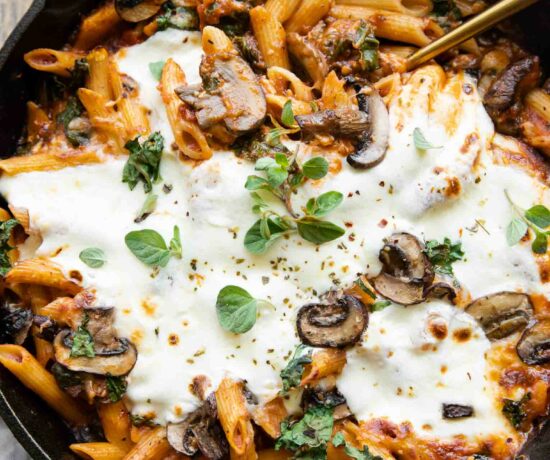 Mushroom & Spinach Pasta Bake recipe with a serving spoon.