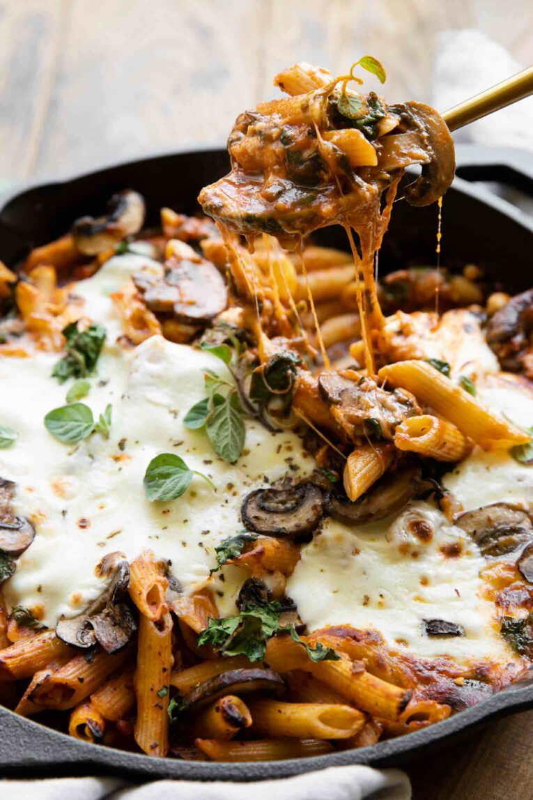 Mushroom & Spinach Pasta Bake recipe in a skillet.