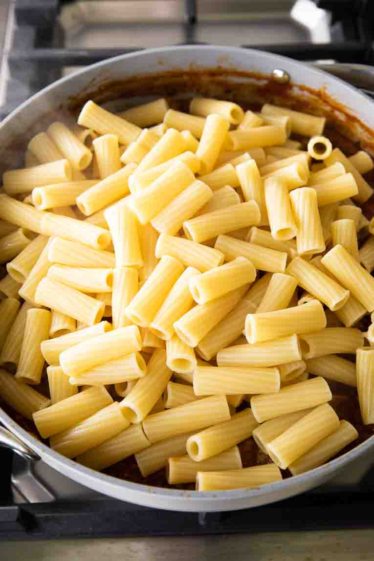 Rigatoni pasta in a large saucepan.