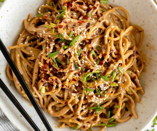 Sesame Tahini Noodles recipe in a bowl with chopsticks.