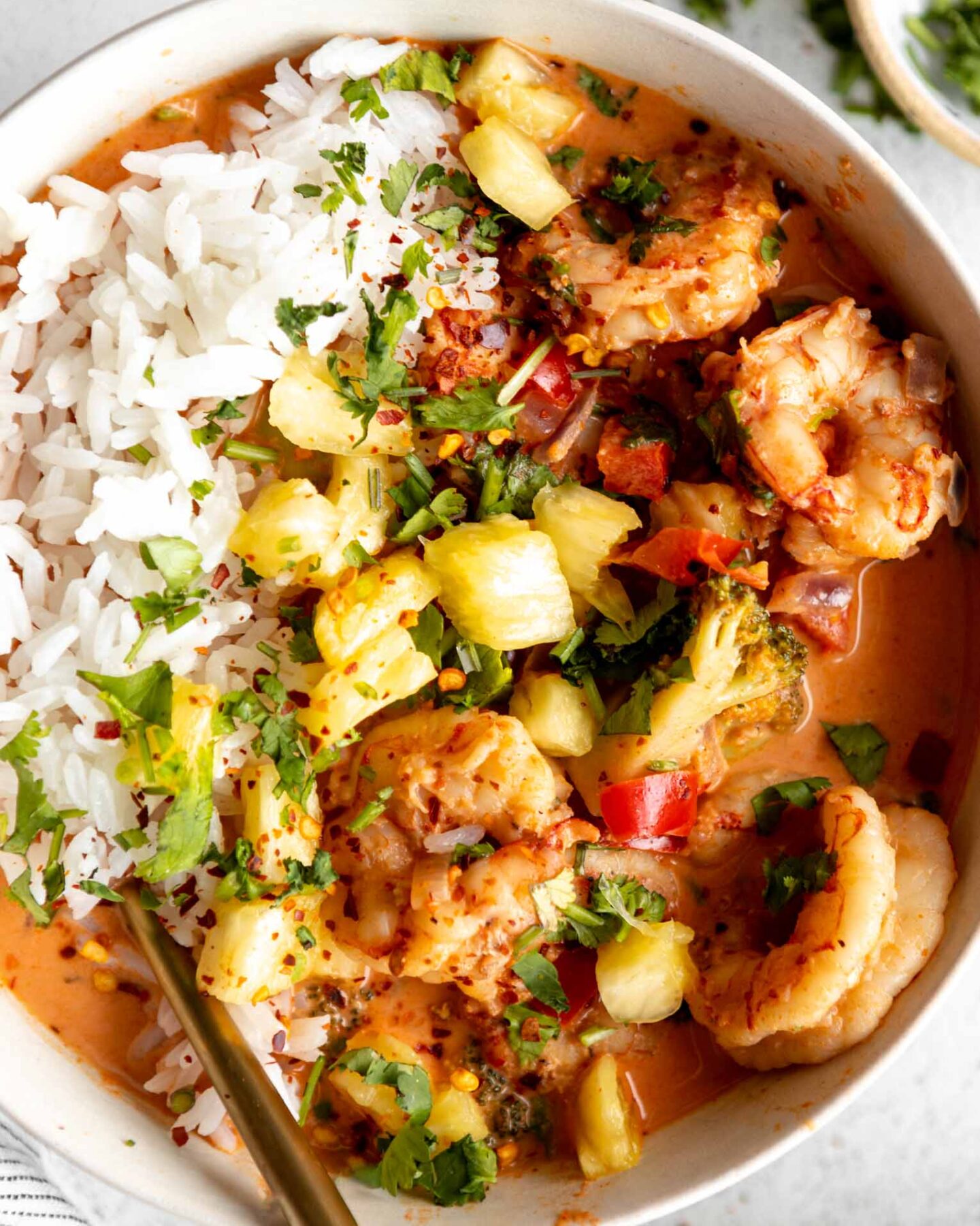 Close up of Thai-Inspired Coconut Curry Shrimp with rice.