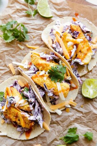 3 Air Fryer Fish Tacos recipe on parchment paper.