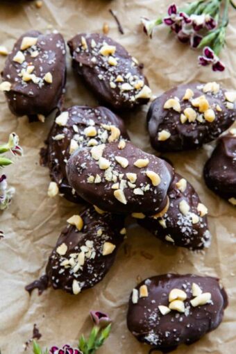 Date Snickers (Peanut Butter Yogurt Dates) on parchment paper.