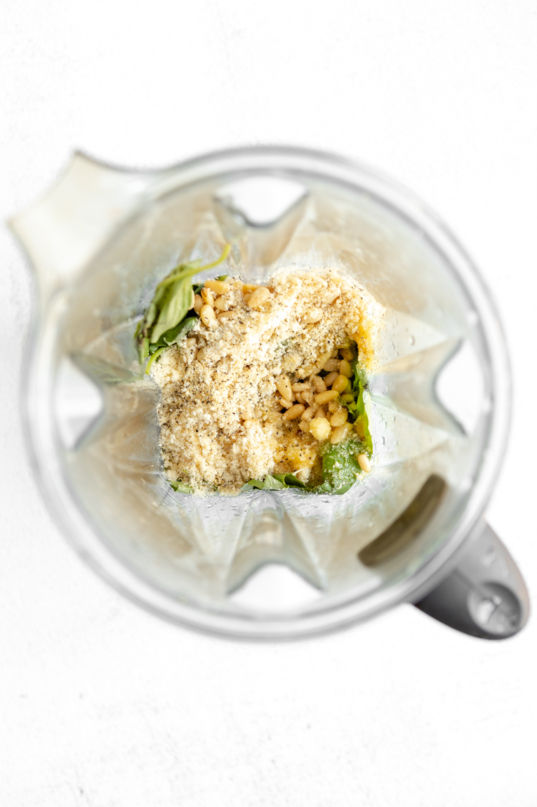 Ingredients for broccoli pesto in a blender.