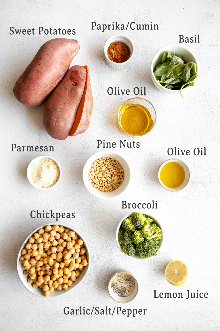 Stuffed sweet potatoes baked with chickpeas and broccoli pesto ingredients.