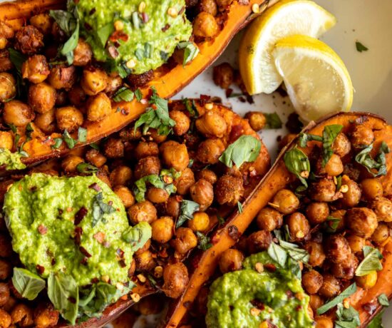 Baked Sweet Potatoes w/ Chickpeas & Broccoli Pesto on a plate.