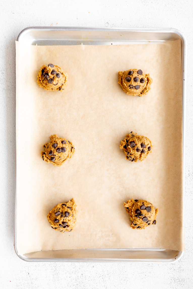 Gluten-free pumpkin cookie dough on a baking sheet.