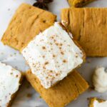 Top shot photo of Gluten-Free Pumpkin Bars with icing and pumpkin spice.