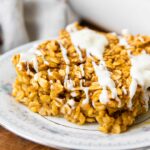 Close up of Pumpkin Baked Oatmeal with white chocolate drizzle.