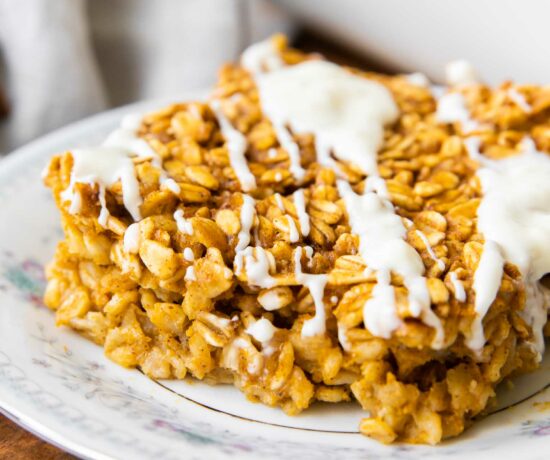 Close up of Pumpkin Baked Oatmeal with white chocolate drizzle.