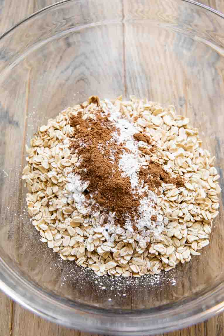 Dry ingredients for baked oatmeal in a large mixing bowl.