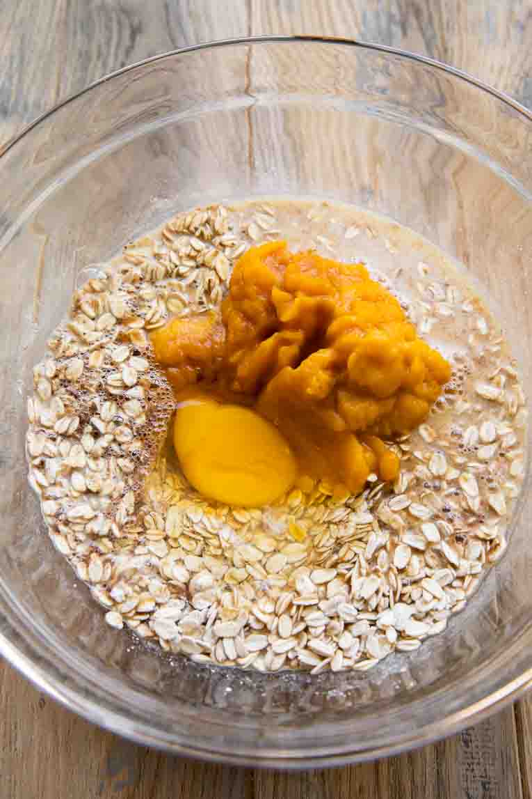 Liquid ingredients on top of oats for baked oatmeal.