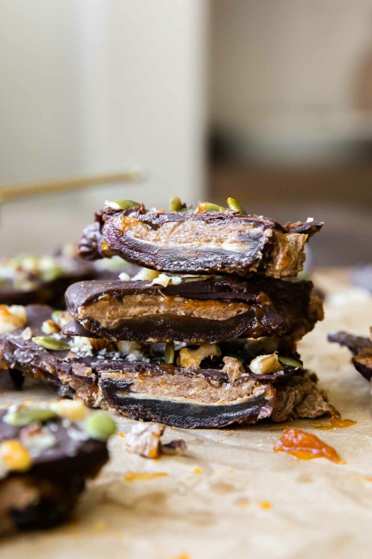 Pumpkin Butter Date Bark chocolate pieces stacked.