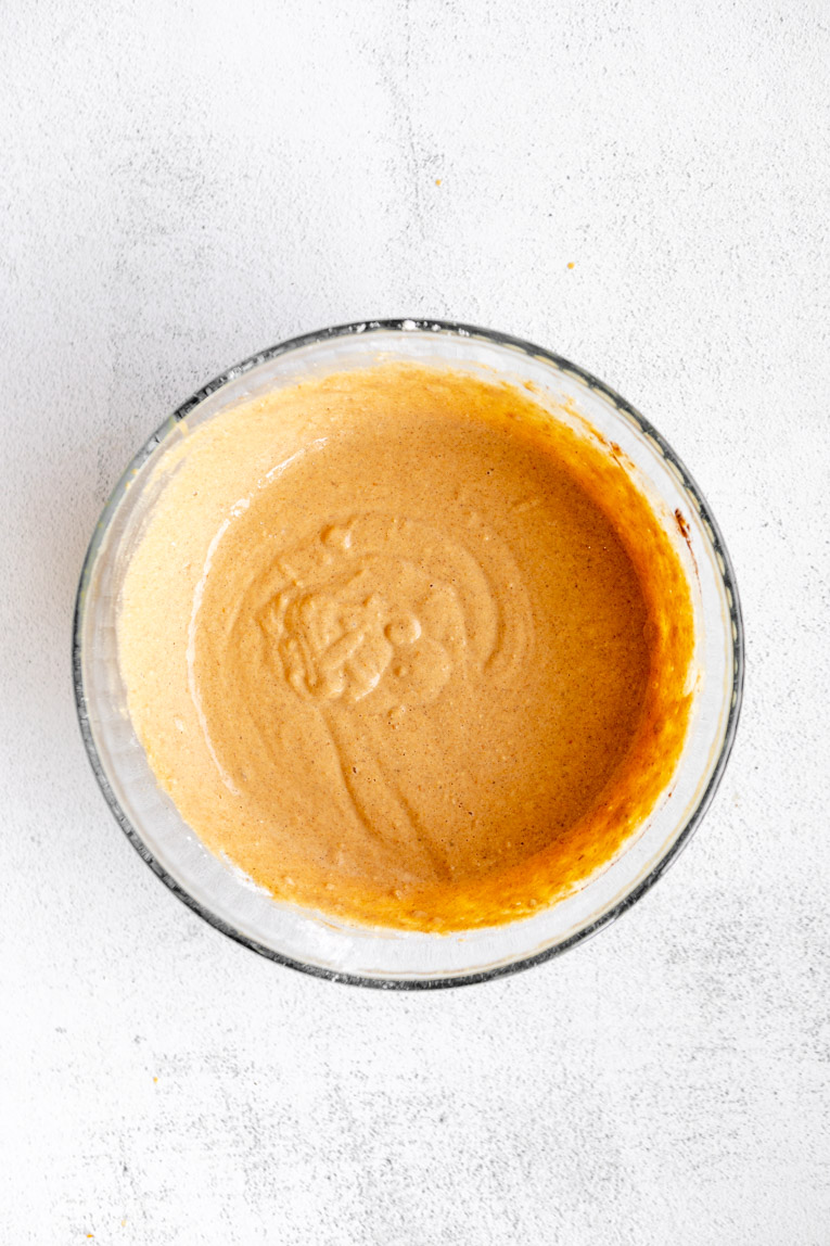 Pumpkin oat pancakes batter in a mixing bowl.