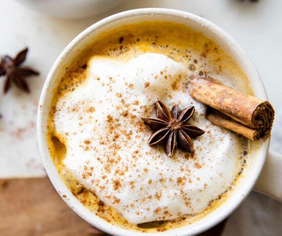 Top shot photo of Pumpkin Spice Chai Latte with anise and cinnamon.