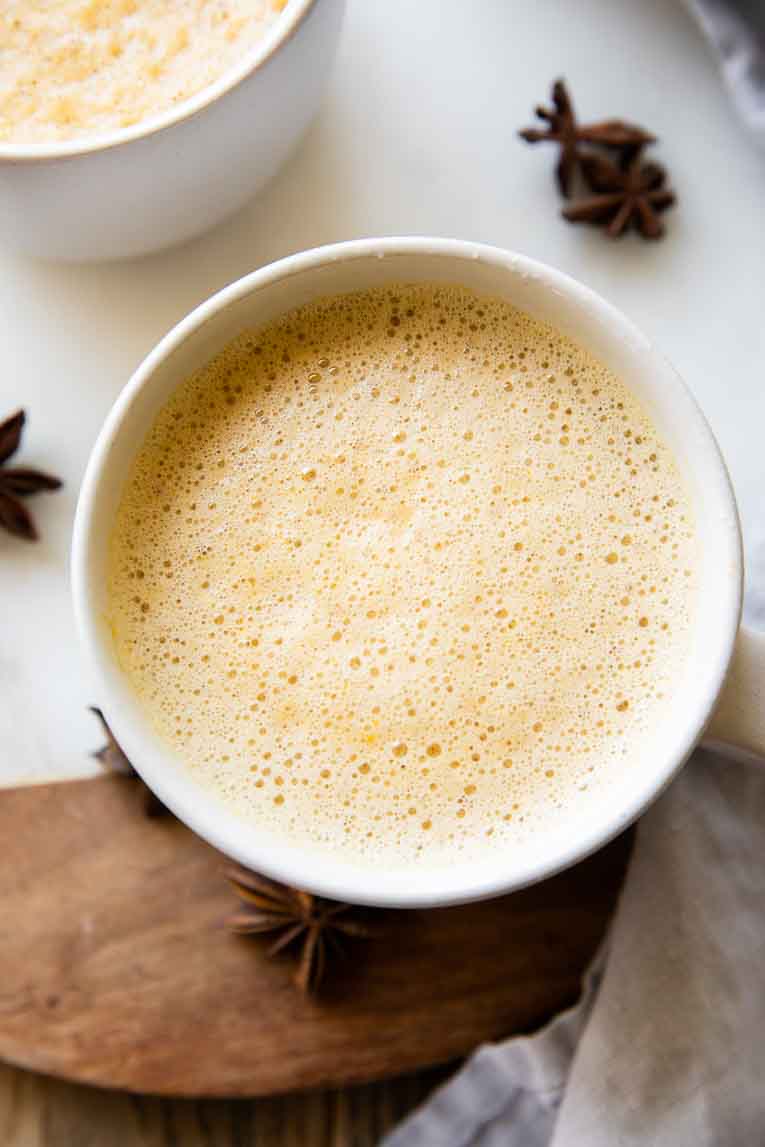 Frothy chai tea latte in a mug.