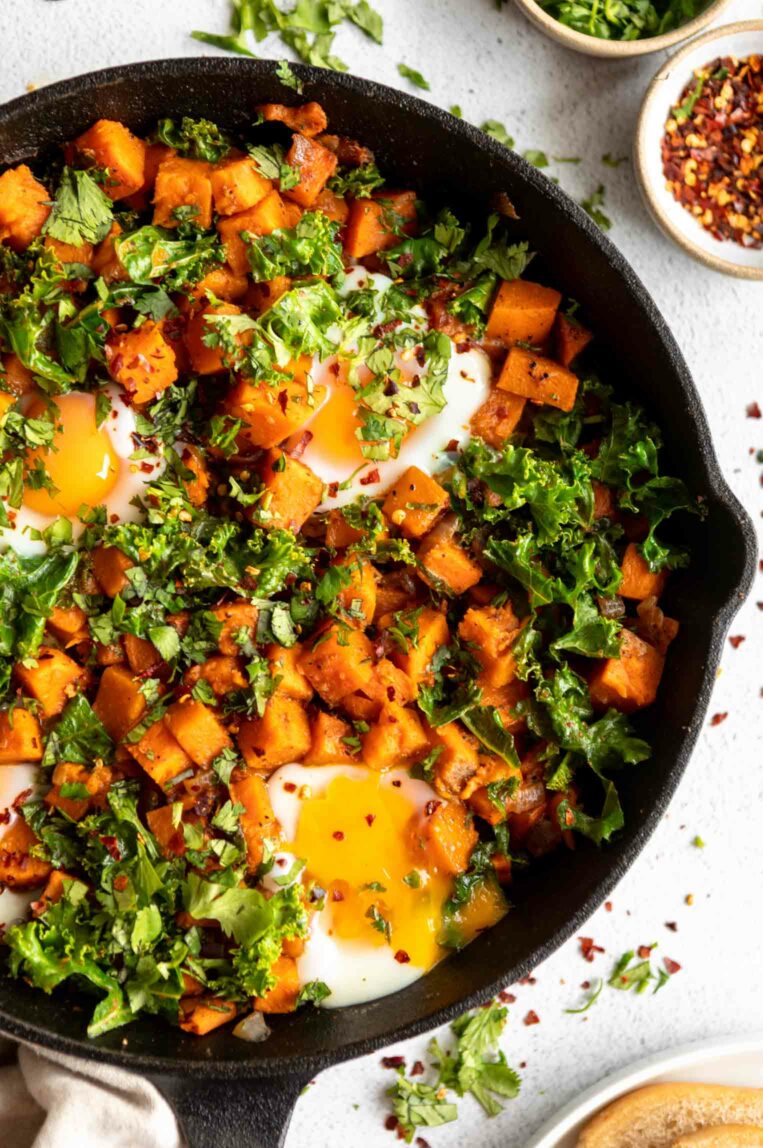 Close up of Skillet Sweet Potato Kale Hash in cast iron skillet.