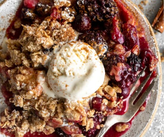 Apple Blackberry Cranberry Crumble on a plate.