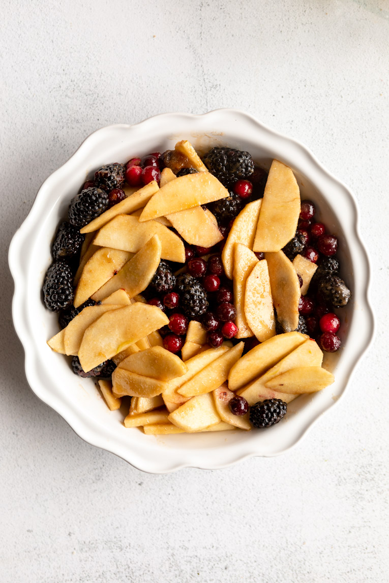 Fall fruit mixture poured into a pie dish.