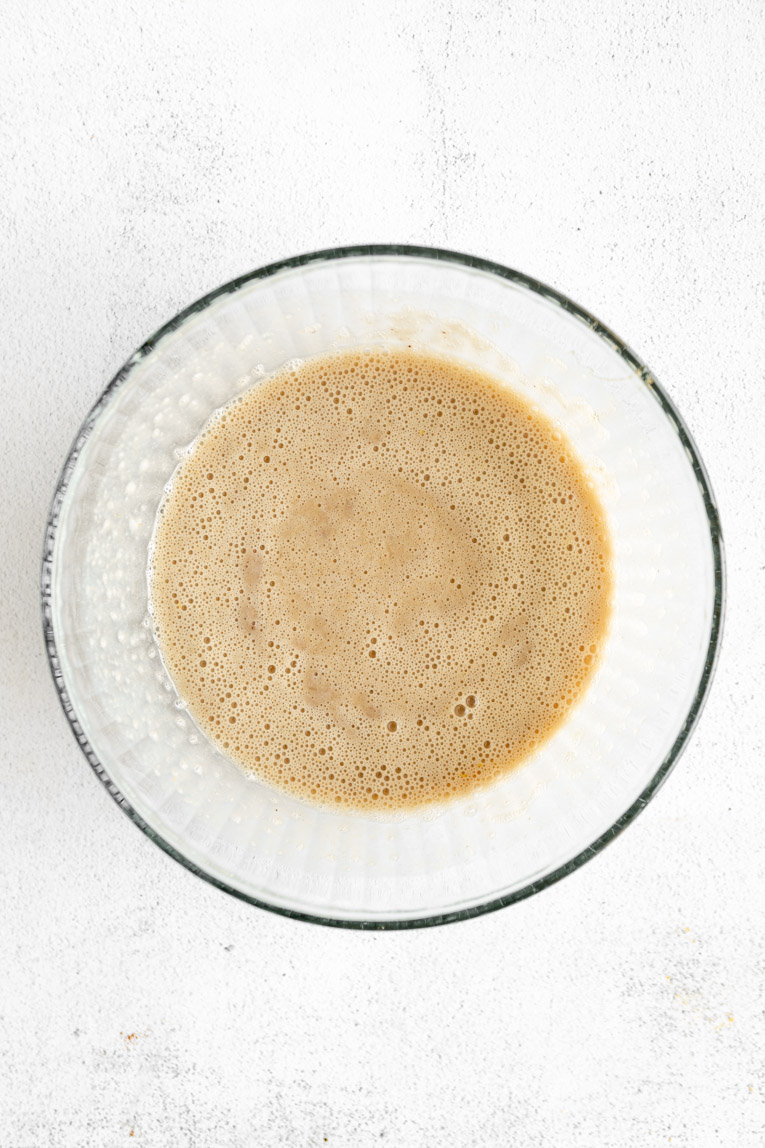 Liquid ingredients mixed a large bowl for oatmeal cups.