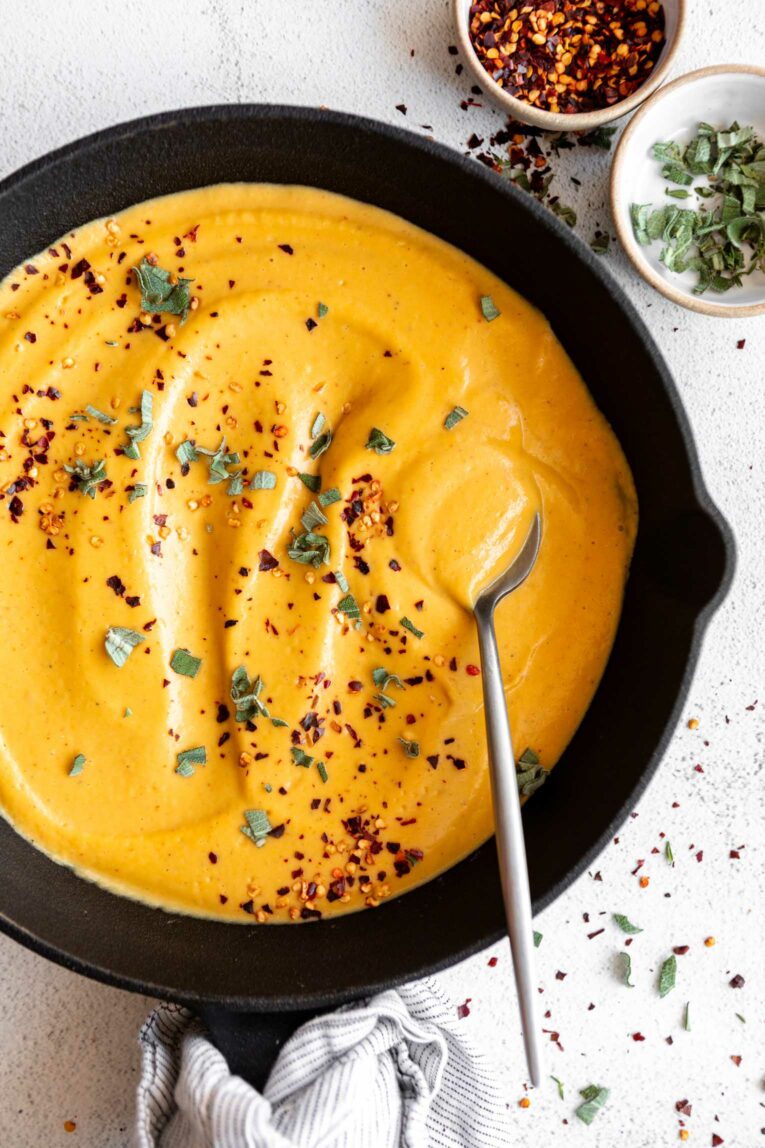 Butternut Squash Ravioli sauce in a cast iron skillet.