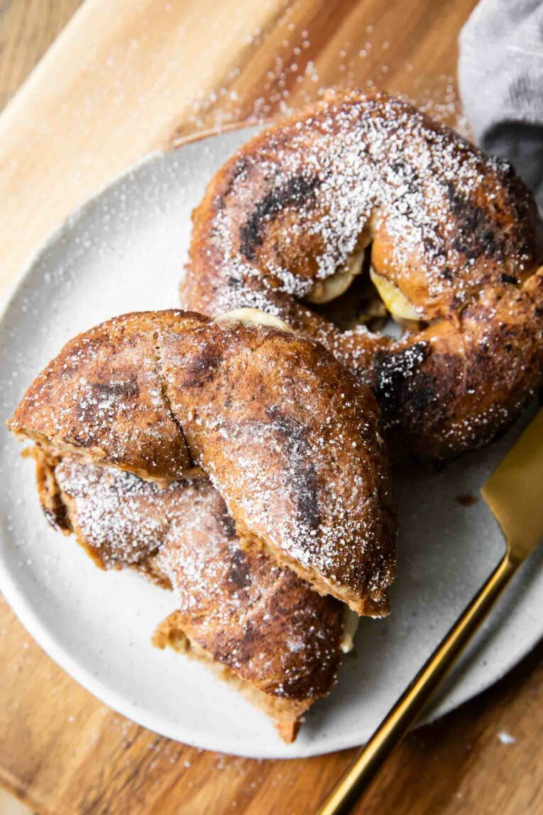 Top shot of two Cinnamon Raisin Bagel French Toast Sandwiches.