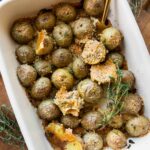 Crispy Garlic Parmesan Crusted Potatoes recipe in a baking dish.