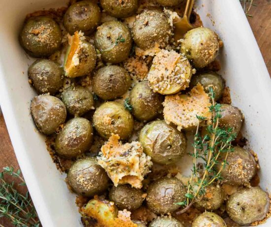 Crispy Garlic Parmesan Crusted Potatoes recipe in a baking dish.