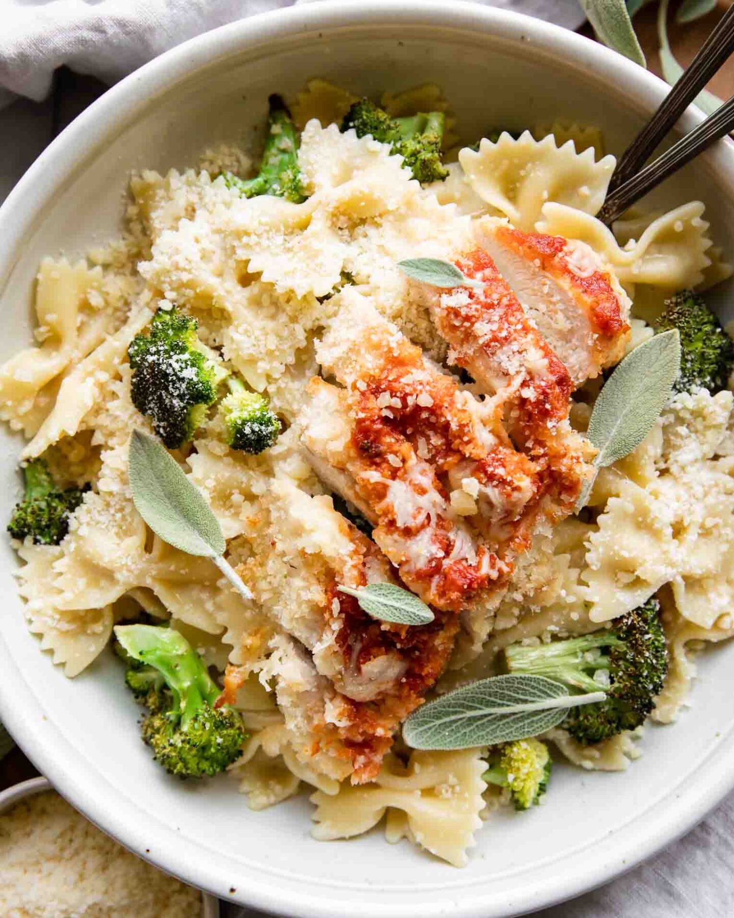 Garlic Parmesan Chicken Pasta in a bowl with forks.