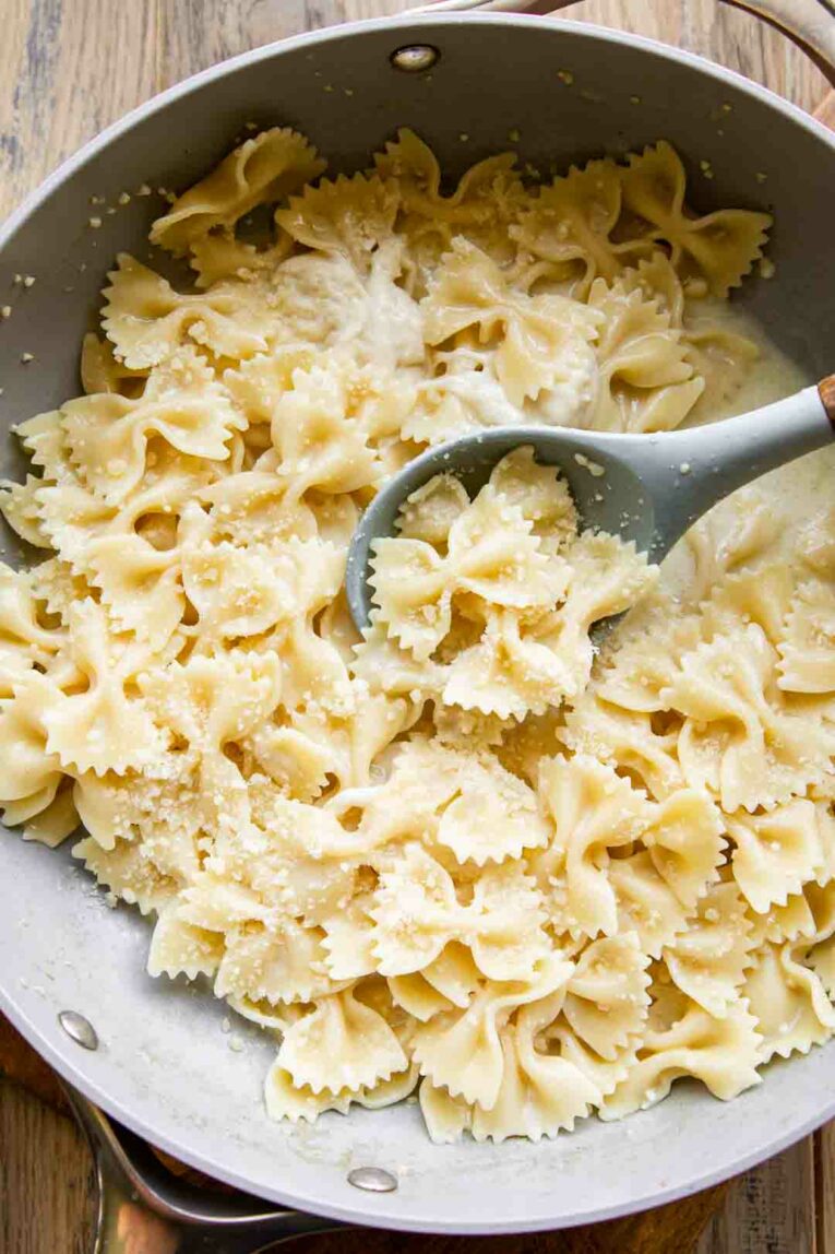 Bow-tie pasta in a garlic parmesan pasta sauce.