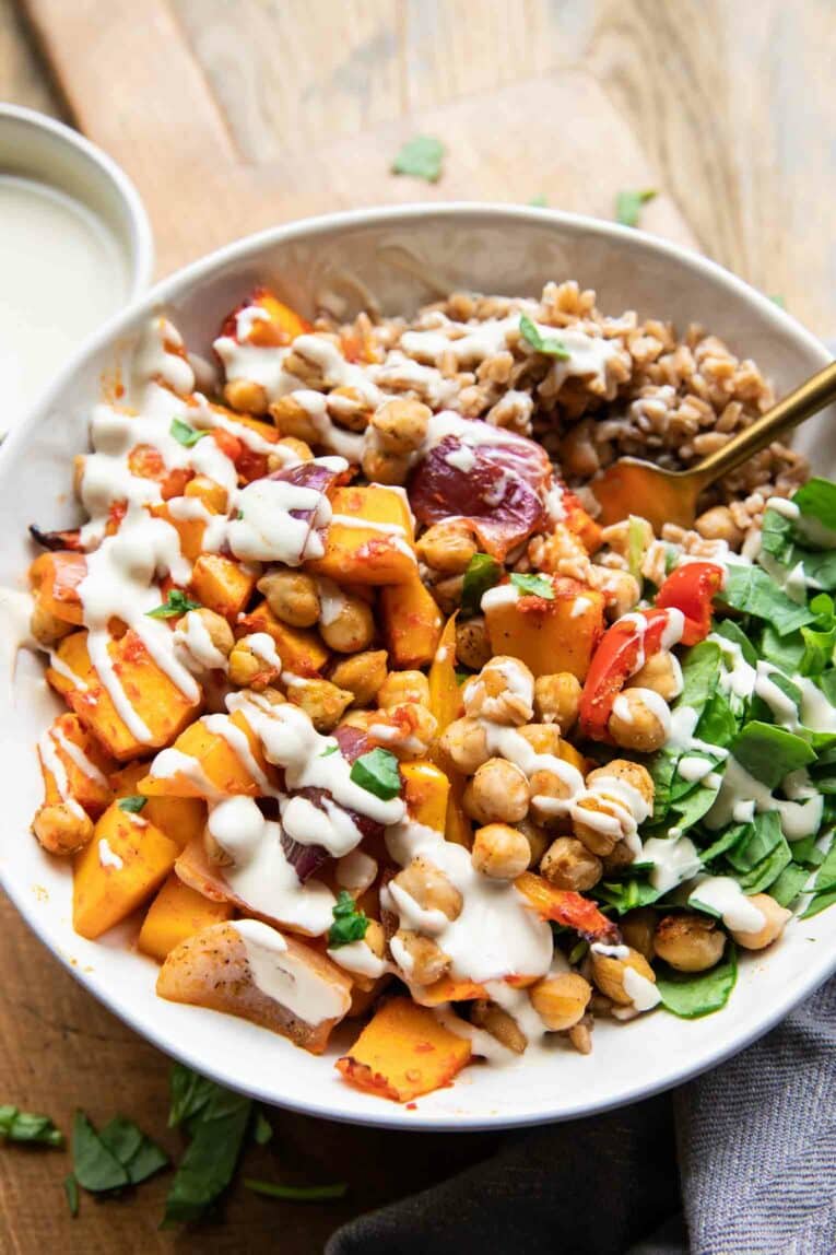 Angled photo of Harissa Veggie Bowl with tahini.