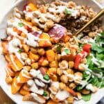 Harissa Veggie Bowls recipe with a fork and tahini drizzle!