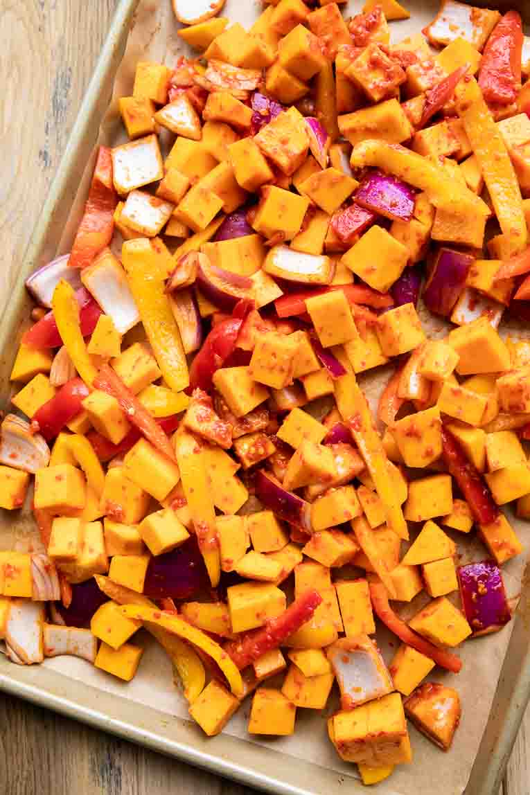Harissa vegetables on a sheet pan.