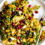 Kale & Brussels Sprouts Curry Quinoa Salad with pomegranate and almonds.