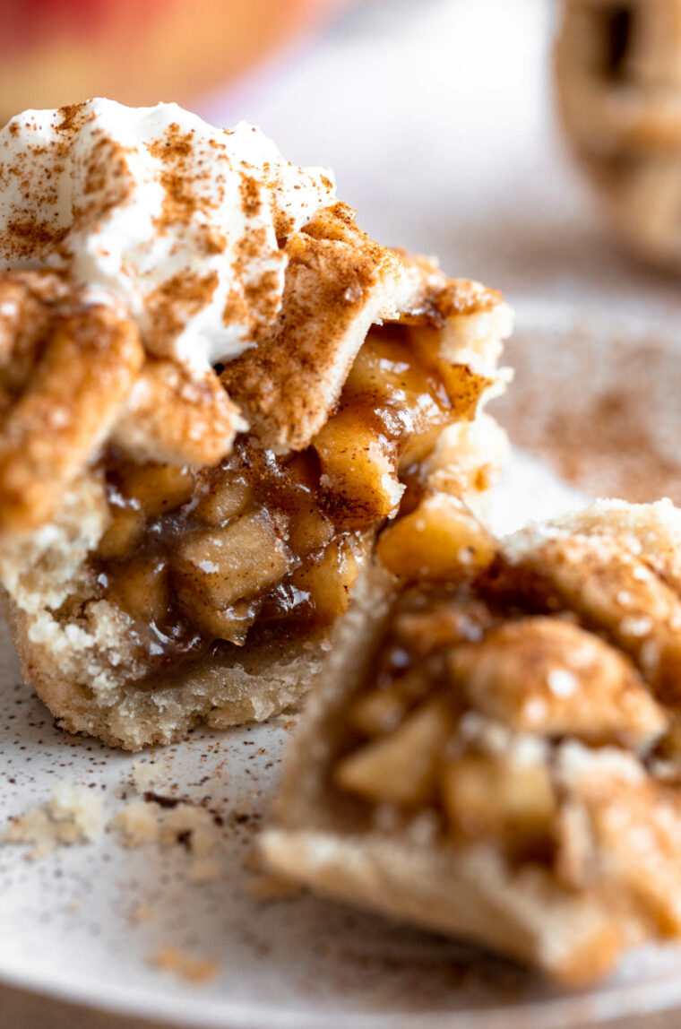 Bite taken out of mini apple pies.