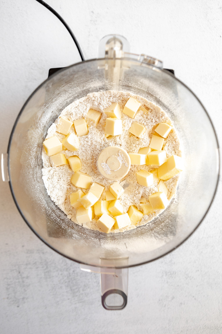 Cubed butter with flour and salt in food processor.