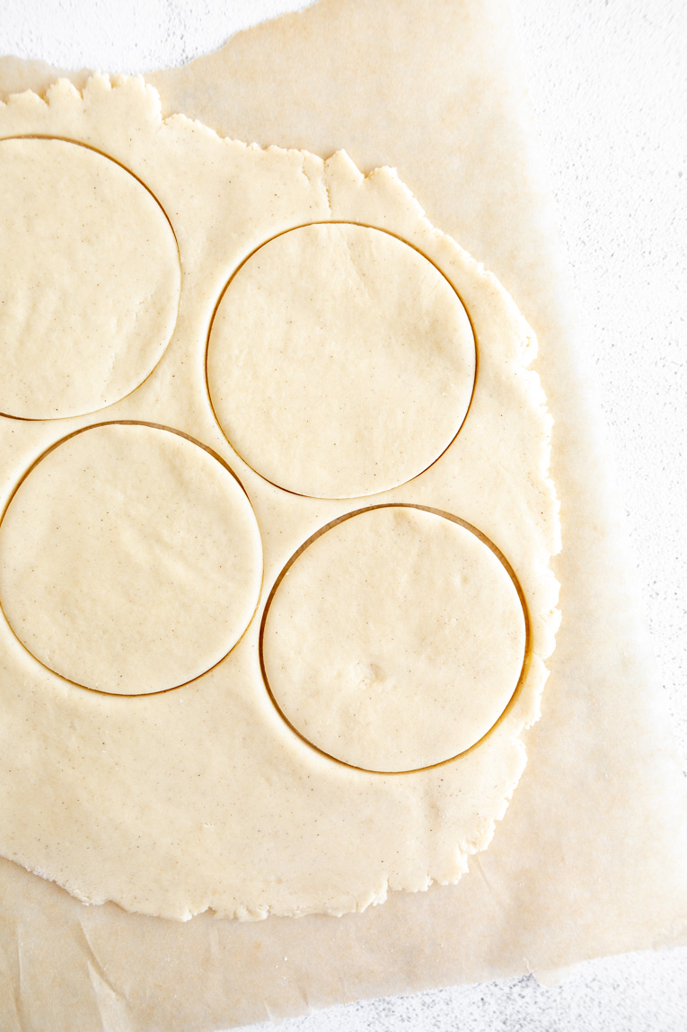 Gluten-free pie dough rolled out and cut into circles.