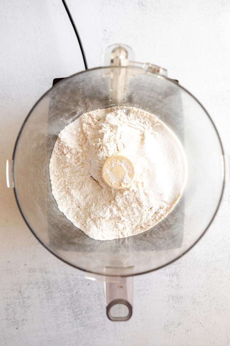 Dry ingredients for pie crust in a food processor.