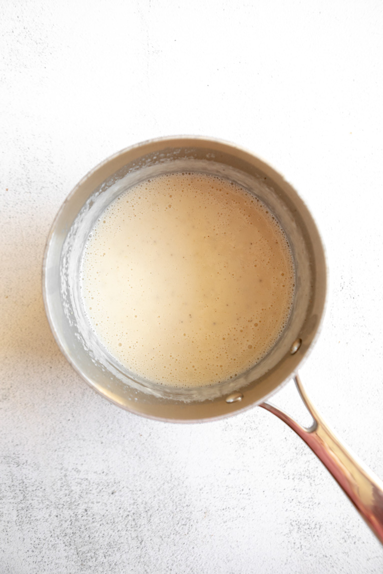 Butter melted in a saucepan.