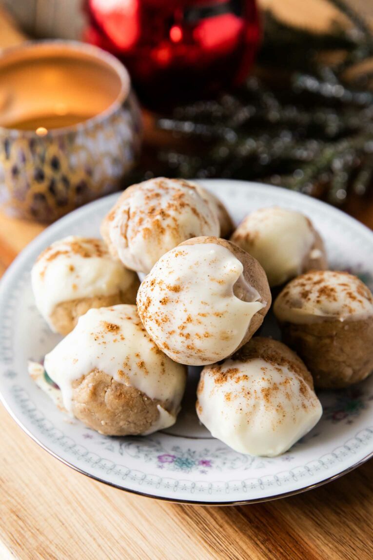 Angled photos of Gingerbread Cookie Protein Bites on a plate.