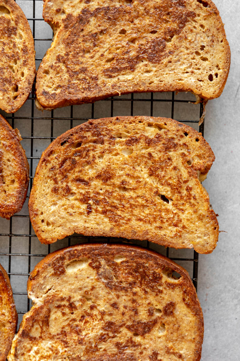 Brioche french toast cooked and on cooling rack.